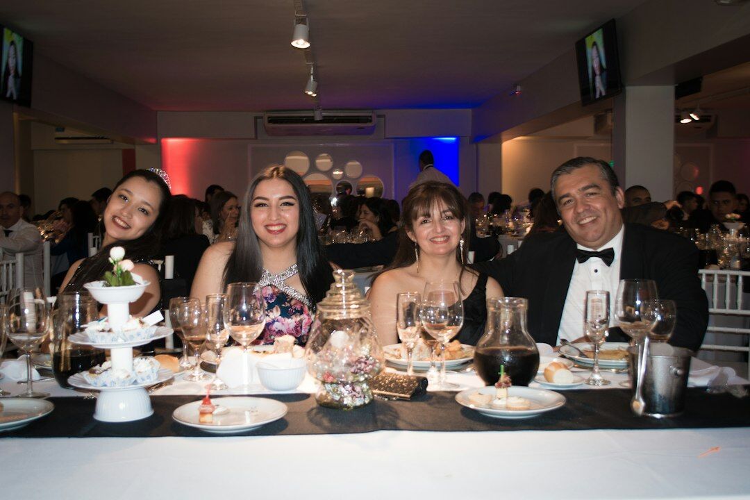 Elegantly dressed guests at a formal cultural gala reception